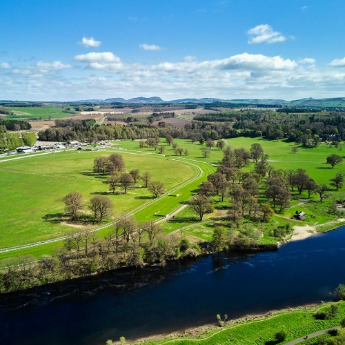 Perth Race course from the air showing River Tay, full track and Scone Palace parklands in April, trees not yet in full leaf